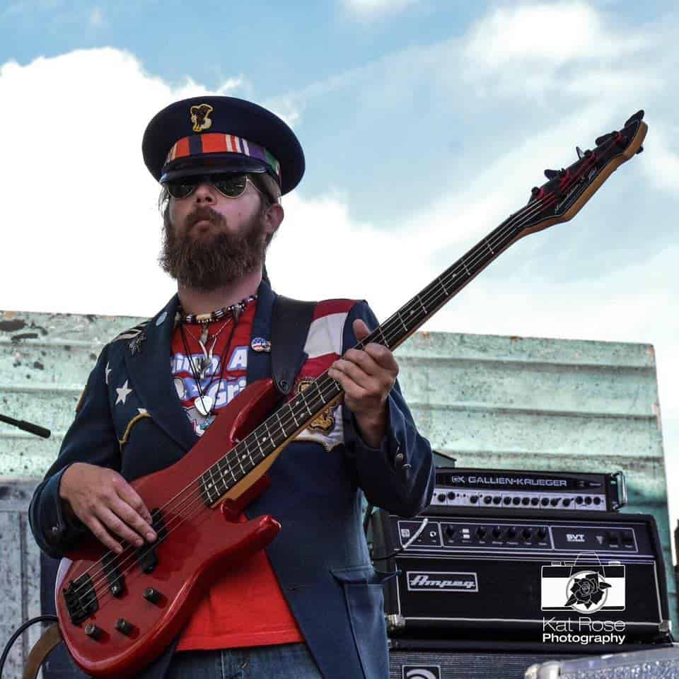 Taylor playing bass on stage with Johnny Wheels & The Swamp Donkeys at the Portland Blues Festival's Journey To Memphis contest .